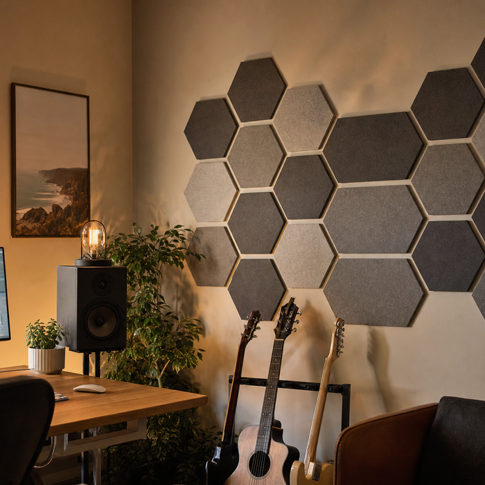 Hexagon acoustic foam panels mounted on a home studio wall with warm ambient lighting